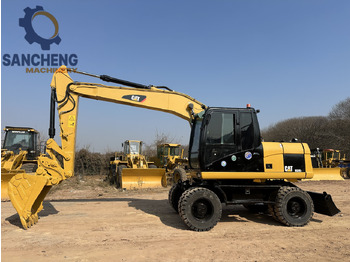 حفارة على عجلات CATERPILLAR M320