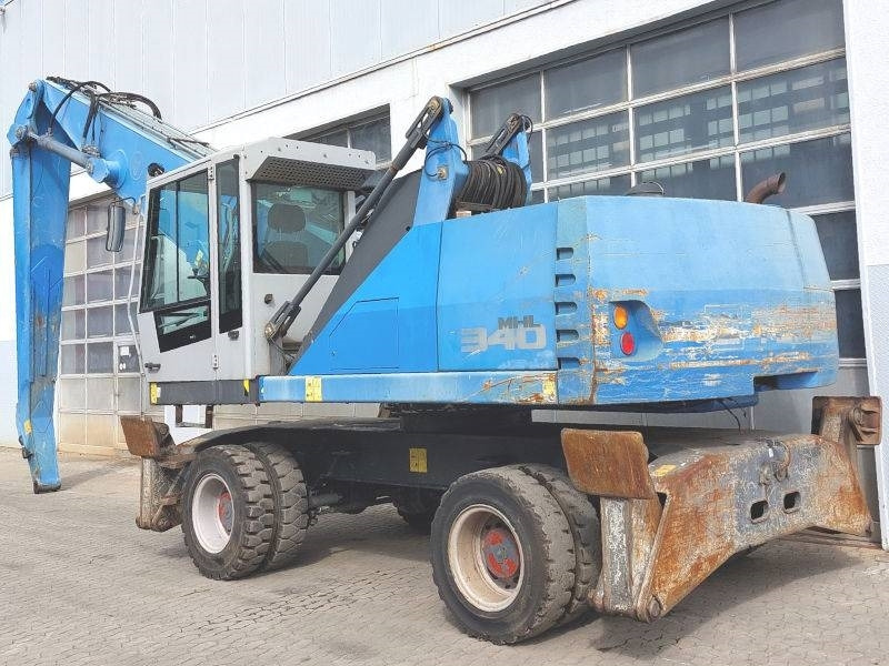 Fuchs MHL 340 E - حفارة النقل والشحن: صور 3 Fuchs MHL 340 E - حفارة النقل والشحن: صور 3