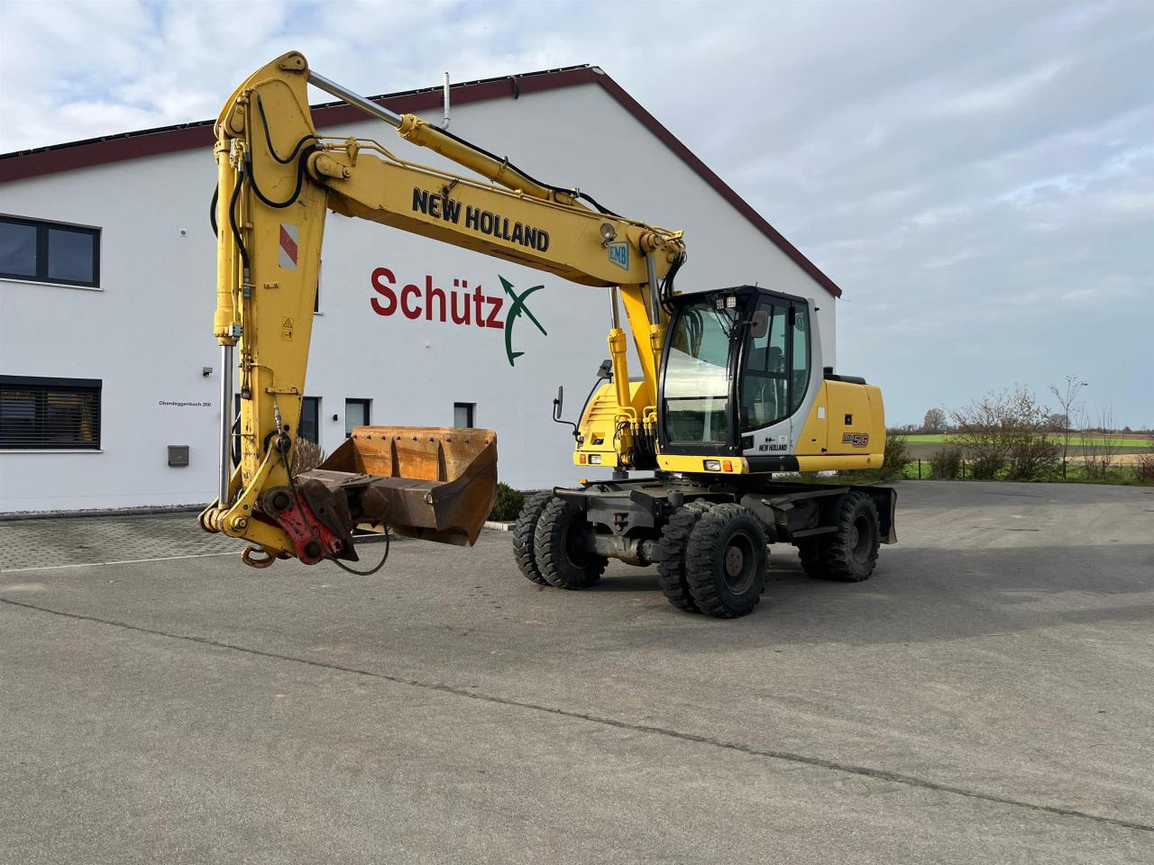 New Holland MH 5.6 inkl. Grabenlöffel, Tieflöffel - حفارة على عجلات: صور 1 New Holland MH 5.6 inkl. Grabenlöffel, Tieflöffel - حفارة على عجلات: صور 1