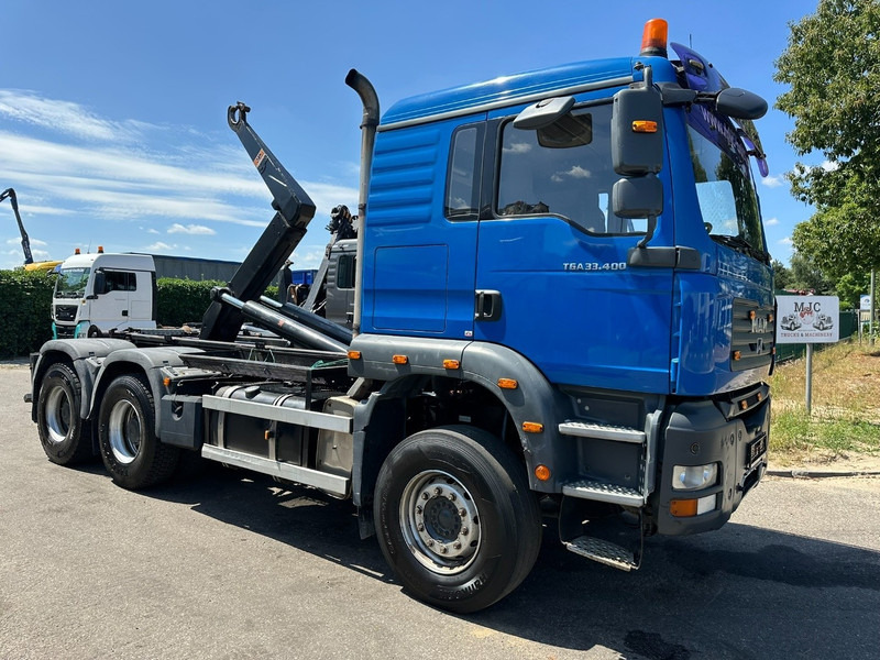MAN TGA 33.400 6X4 HOOKLIFT AJK NHS20-4930mm - WB 3m60 - MANUAL ZF - STEEL SPRING / BLATT - BIG AXLES / AP ACHSEN - شاحنة ذات الخطاف: صور 1 MAN TGA 33.400 6X4 HOOKLIFT AJK NHS20-4930mm - WB 3m60 - MANUAL ZF - STEEL SPRING / BLATT - BIG AXLES / AP ACHSEN - شاحنة ذات الخطاف: صور 1