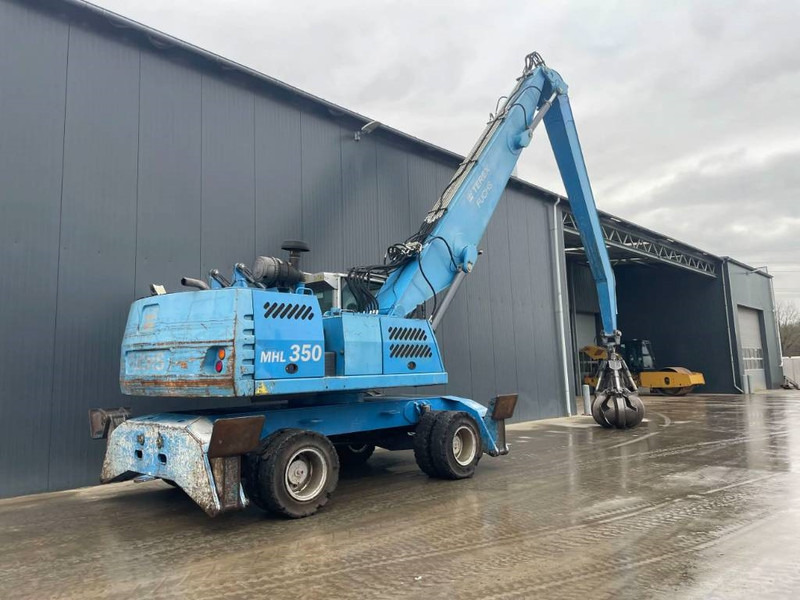 Fuchs MHL350 - حفارة النقل والشحن: صور 5 Fuchs MHL350 - حفارة النقل والشحن: صور 5