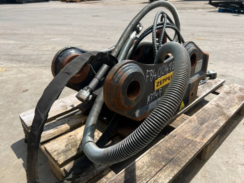 OilQuick OQ65 - M314F / M316F / M318F - وصلة الربط للمعدات المعلقة - آلات البناء: صور 5 OilQuick OQ65 - M314F / M316F / M318F - وصلة الربط للمعدات المعلقة - آلات البناء: صور 5