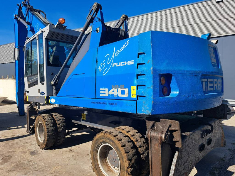 Fuchs MHL340D - حفارة النقل والشحن: صور 1 Fuchs MHL340D - حفارة النقل والشحن: صور 1