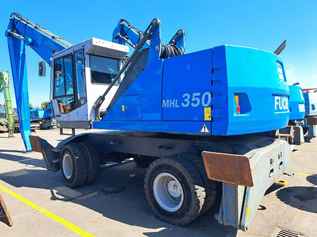 Fuchs MHL350D - حفارة النقل والشحن: صور 1 Fuchs MHL350D - حفارة النقل والشحن: صور 1