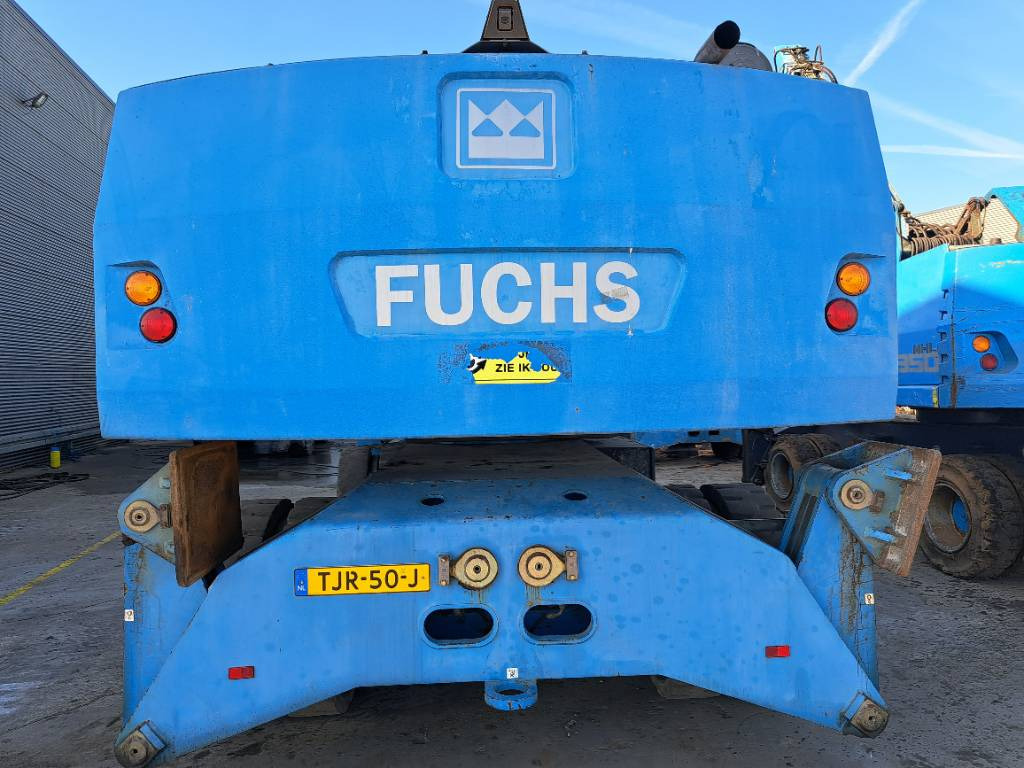 Fuchs MHL360D - حفارة النقل والشحن: صور 3 Fuchs MHL360D - حفارة النقل والشحن: صور 3