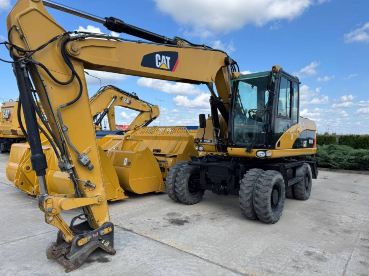 CAT M315D - حفارة على عجلات: صور 1 CAT M315D - حفارة على عجلات: صور 1