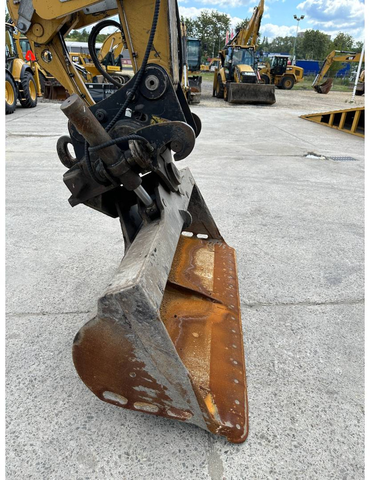 حفارة على عجلات CAT M318F: صور 21