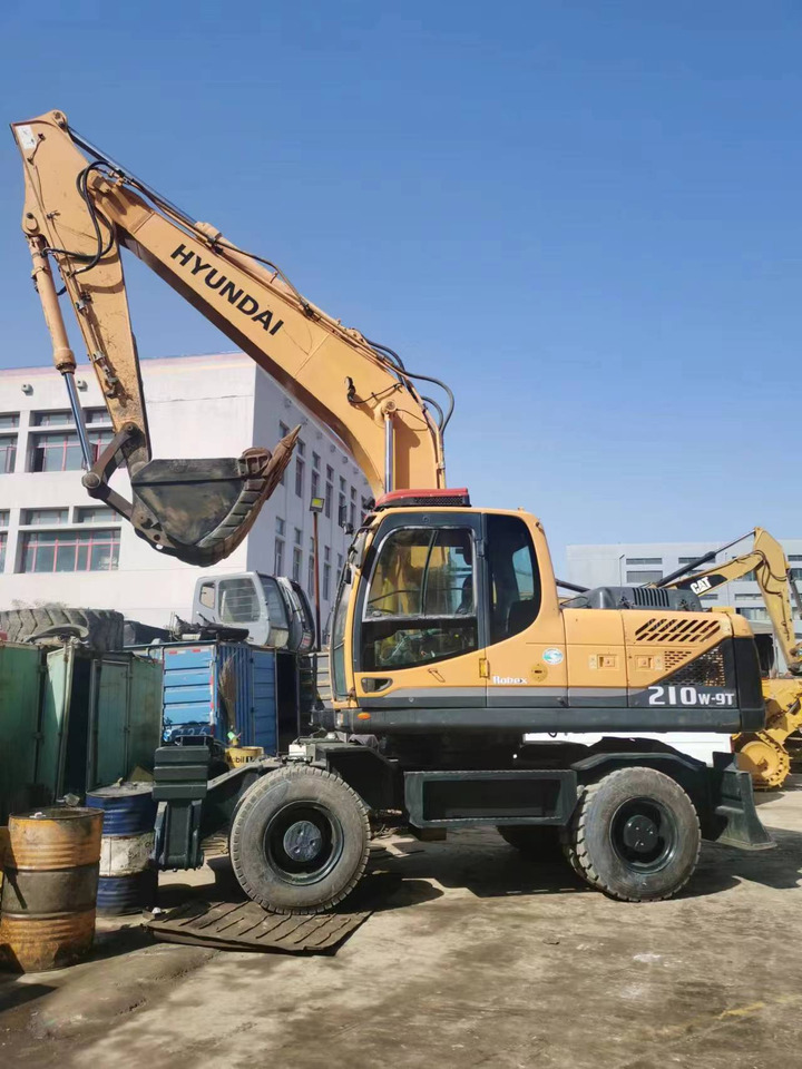 HYUNDAI 210W-9 - حفارة على عجلات: صور 1 HYUNDAI 210W-9 - حفارة على عجلات: صور 1