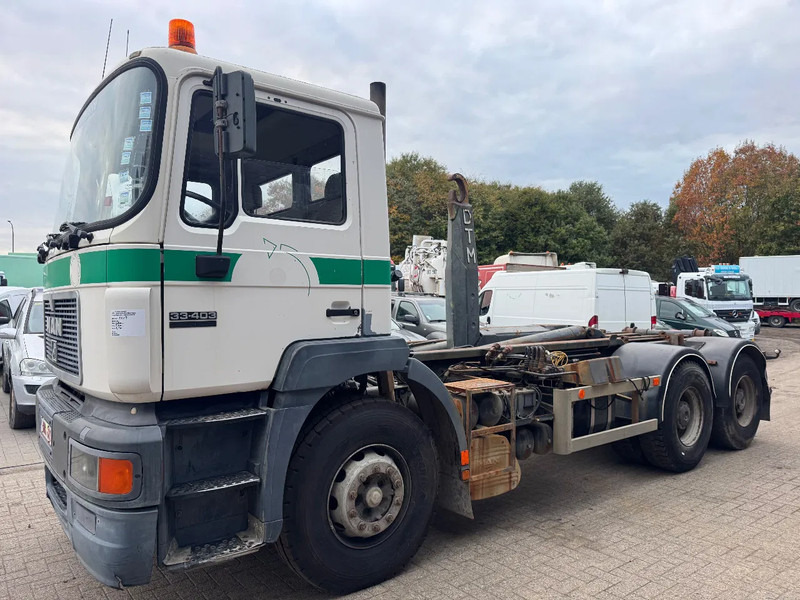 MAN 33.403 **BELGIAN TRUCK-FULL STEEL-MANUAL PUMP** - شاحنة ذات الخطاف: صور 1 MAN 33.403 **BELGIAN TRUCK-FULL STEEL-MANUAL PUMP** - شاحنة ذات الخطاف: صور 1