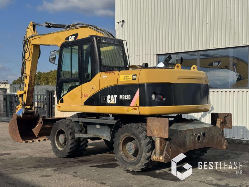 Caterpillar M313D - حفارة على عجلات: صور 2 Caterpillar M313D - حفارة على عجلات: صور 2