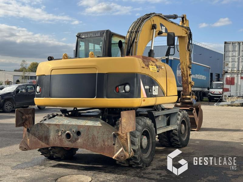 Caterpillar M313D - حفارة على عجلات: صور 3 Caterpillar M313D - حفارة على عجلات: صور 3
