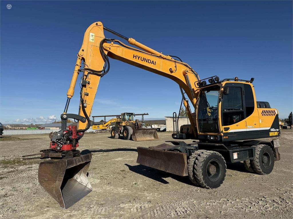 Hyundai Robex 140 W-9A Rototilt + grap - حفارة على عجلات: صور 1 Hyundai Robex 140 W-9A Rototilt + grap - حفارة على عجلات: صور 1