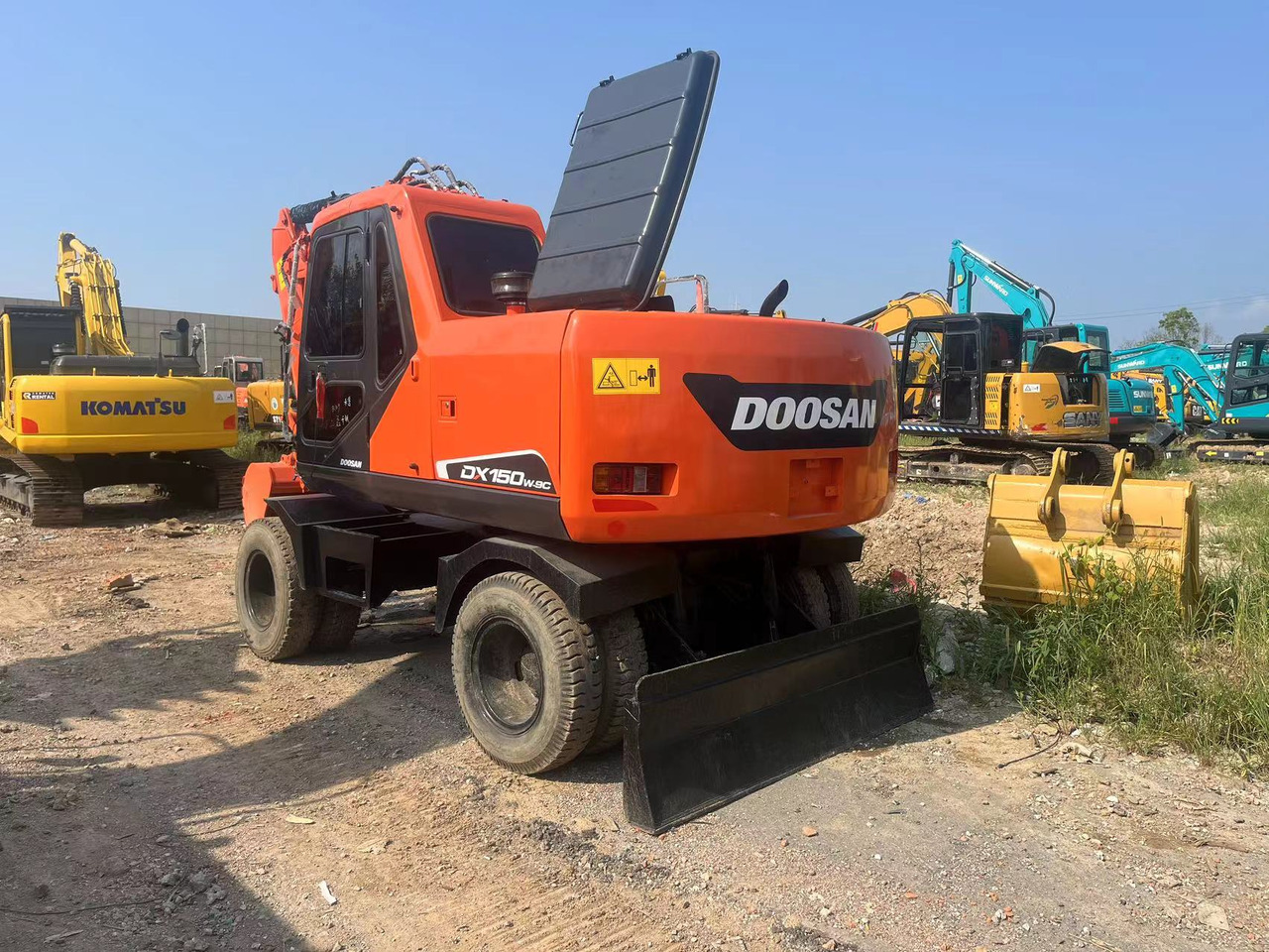 Doosan DX150W-9C - حفارة على عجلات: صور 4 Doosan DX150W-9C - حفارة على عجلات: صور 4