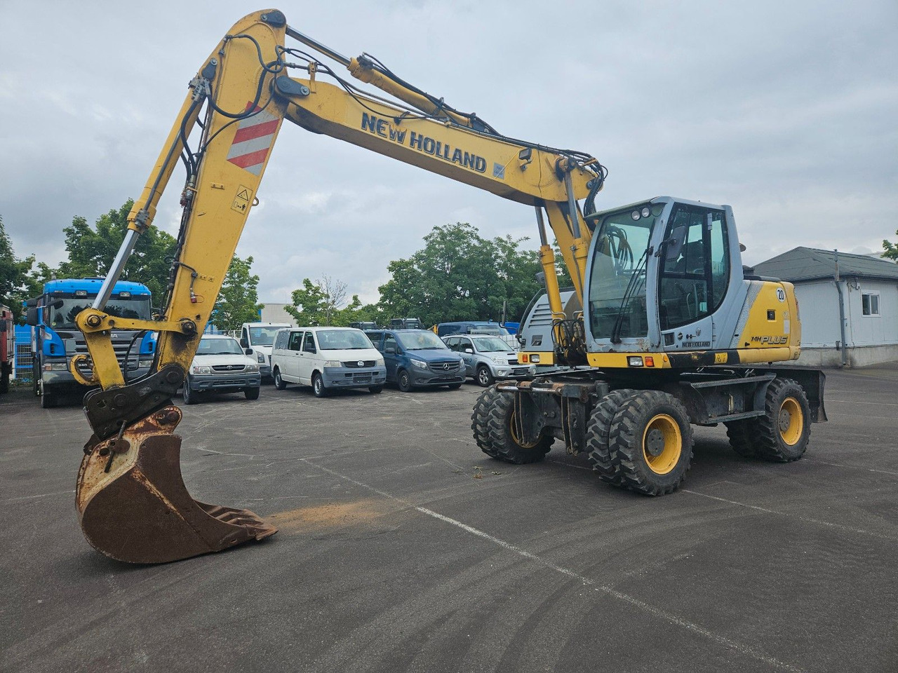 New Holland MH Plus 18t Mobilbagger - حفارة على عجلات: صور 1 New Holland MH Plus 18t Mobilbagger - حفارة على عجلات: صور 1