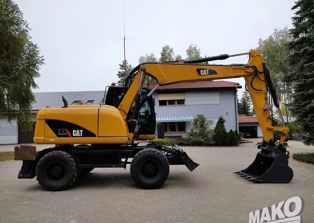 Caterpillar M313D - حفارة على عجلات: صور 5 Caterpillar M313D - حفارة على عجلات: صور 5