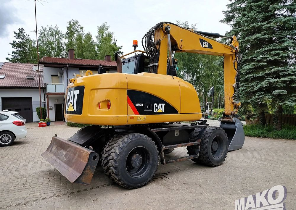 Caterpillar M313D - حفارة على عجلات: صور 4 Caterpillar M313D - حفارة على عجلات: صور 4