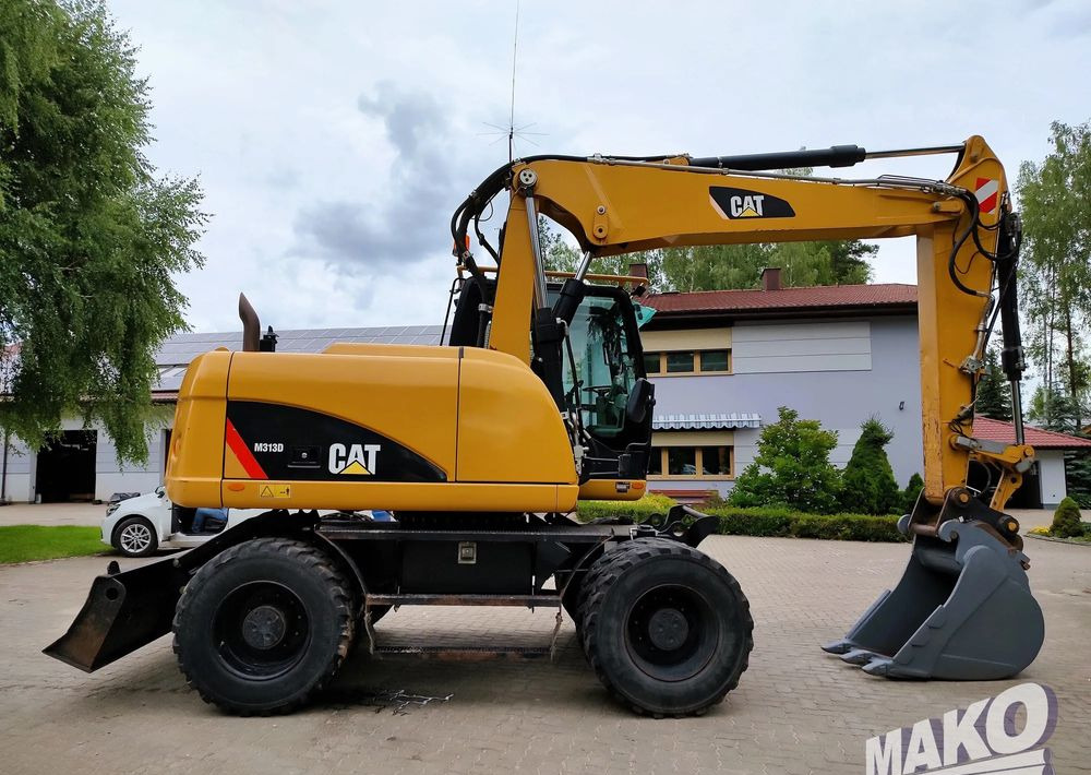 Caterpillar M313D - حفارة على عجلات: صور 5 Caterpillar M313D - حفارة على عجلات: صور 5
