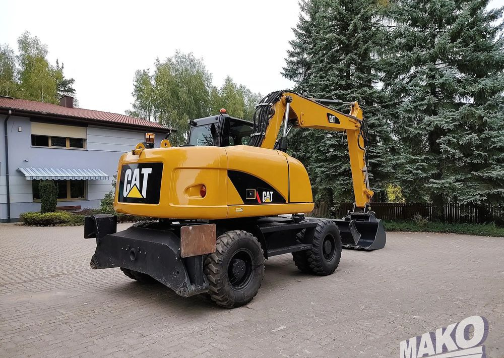 Caterpillar M313D - حفارة على عجلات: صور 4 Caterpillar M313D - حفارة على عجلات: صور 4