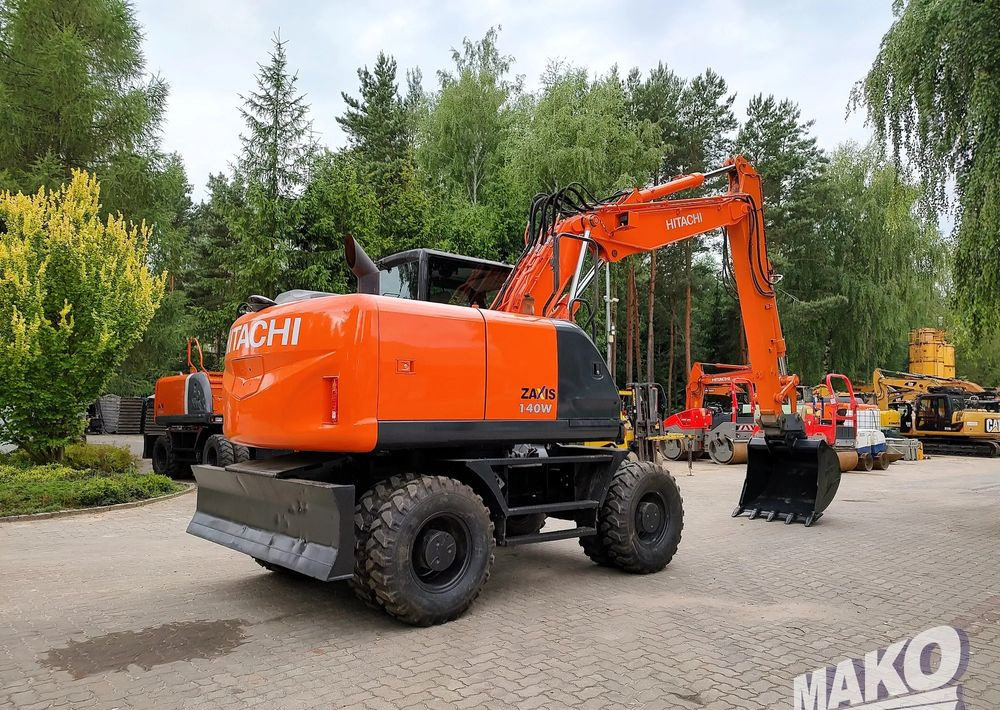 Hitachi ZX 140 - حفارة على عجلات: صور 4 Hitachi ZX 140 - حفارة على عجلات: صور 4