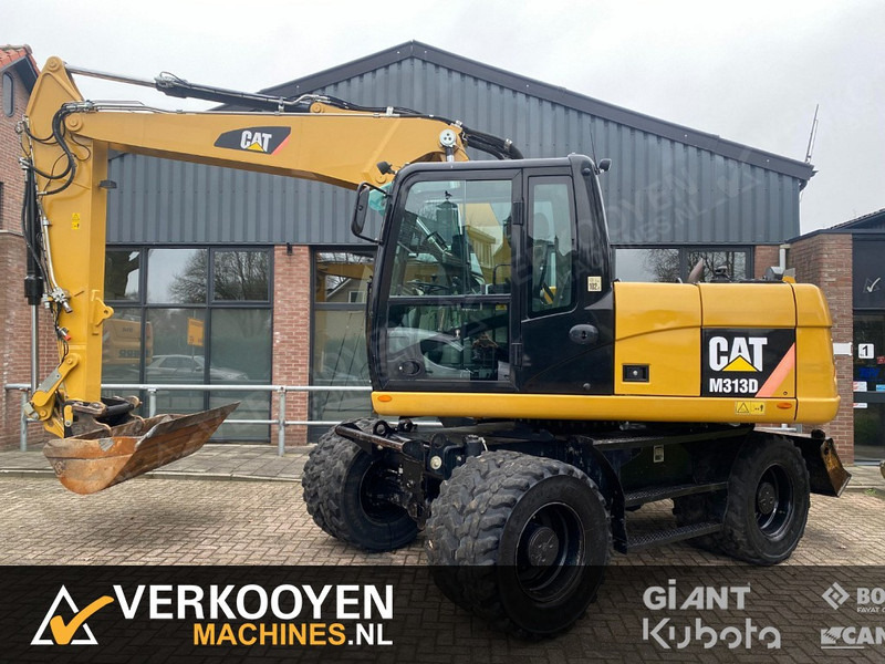Caterpillar M313D - حفارة على عجلات: صور 1 Caterpillar M313D - حفارة على عجلات: صور 1