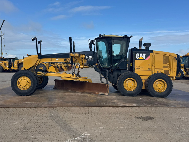 Caterpillar 140M2 AWD - آلة تسوية الأرض: صور 1 Caterpillar 140M2 AWD - آلة تسوية الأرض: صور 1