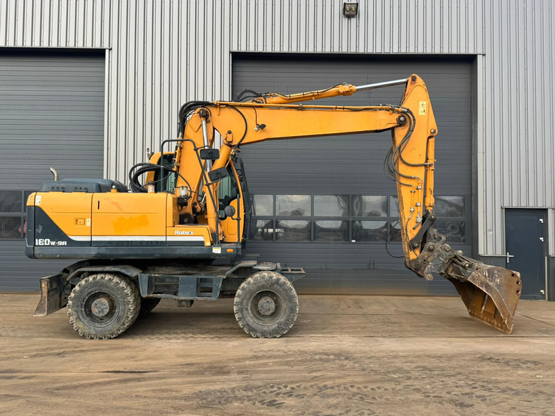 Hyundai Robex 180W-9A - حفارة على عجلات: صور 5 Hyundai Robex 180W-9A - حفارة على عجلات: صور 5