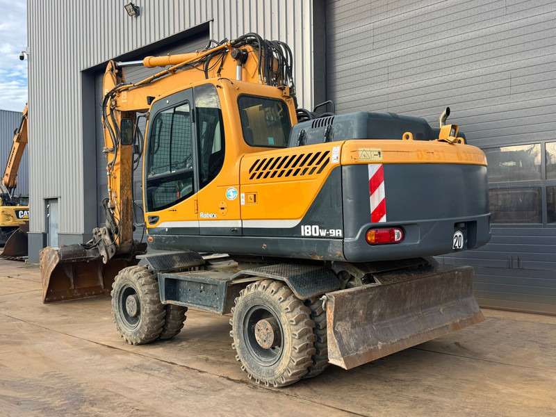 Hyundai Robex 180W-9A - حفارة على عجلات: صور 3 Hyundai Robex 180W-9A - حفارة على عجلات: صور 3