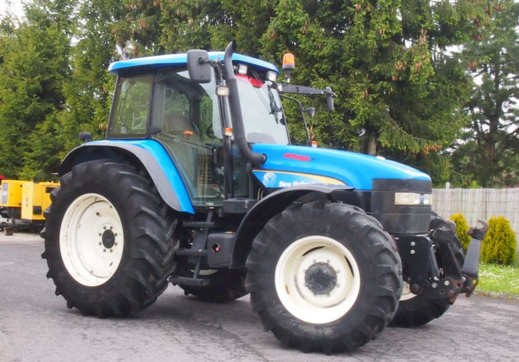 Ciągnik New Holland TM 140 2004 Przedni TUZ - جرار: صور 1 Ciągnik New Holland TM 140 2004 Przedni TUZ - جرار: صور 1