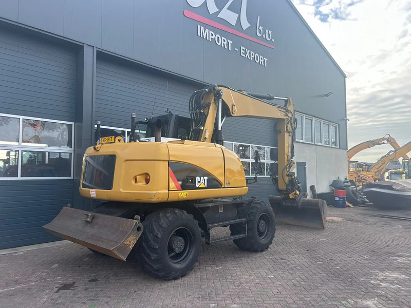 Caterpillar M313D - حفارة على عجلات: صور 4 Caterpillar M313D - حفارة على عجلات: صور 4