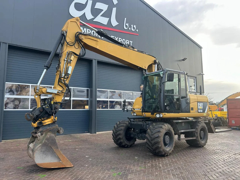 Caterpillar M315D - حفارة على عجلات: صور 1 Caterpillar M315D - حفارة على عجلات: صور 1