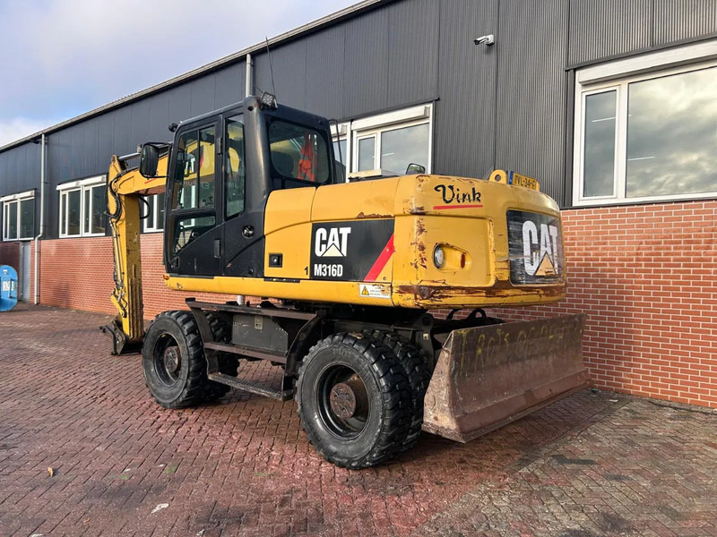 Caterpillar M316D - حفارة على عجلات: صور 4 Caterpillar M316D - حفارة على عجلات: صور 4