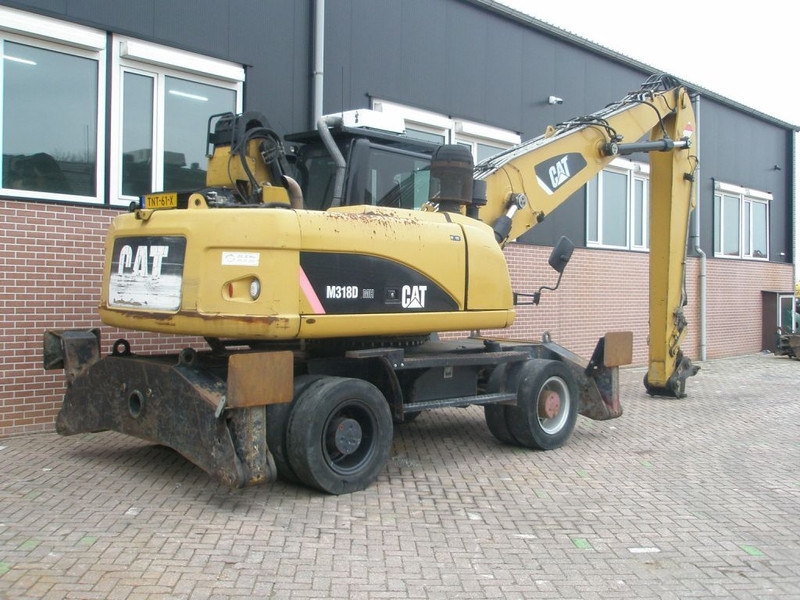 Caterpillar M318D - حفارة على عجلات: صور 4 Caterpillar M318D - حفارة على عجلات: صور 4
