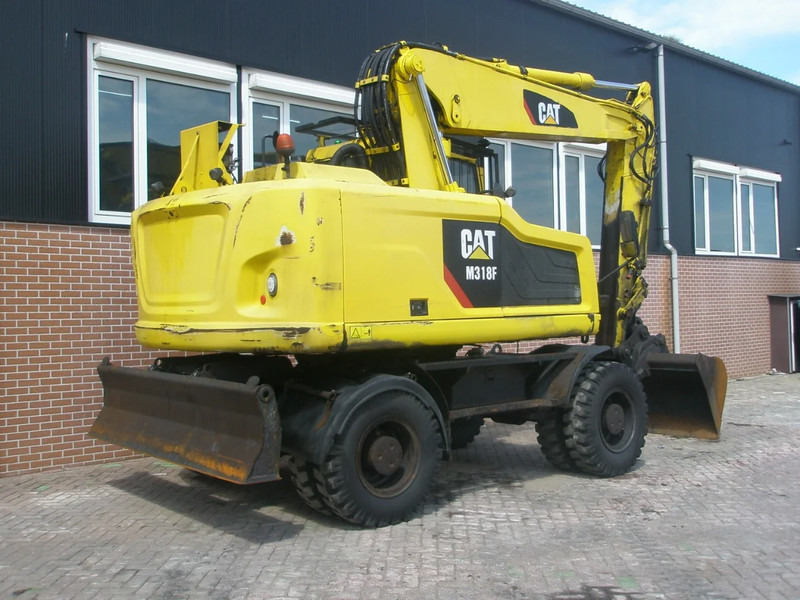 Caterpillar M318F - حفارة على عجلات: صور 3 Caterpillar M318F - حفارة على عجلات: صور 3