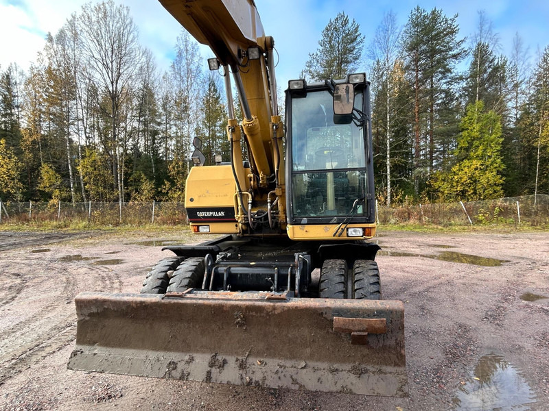 Caterpillar M312 Engcon EC20 tiltrotator - حفارة على عجلات: صور 3 Caterpillar M312 Engcon EC20 tiltrotator - حفارة على عجلات: صور 3