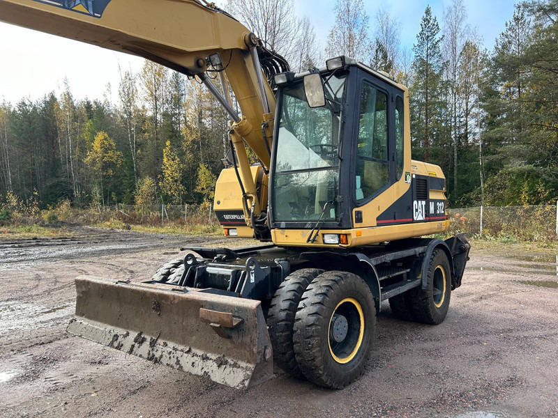 Caterpillar M312 Engcon EC20 tiltrotator - حفارة على عجلات: صور 2 Caterpillar M312 Engcon EC20 tiltrotator - حفارة على عجلات: صور 2