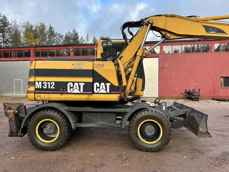 Caterpillar M312 Engcon EC20 tiltrotator - حفارة على عجلات: صور 5 Caterpillar M312 Engcon EC20 tiltrotator - حفارة على عجلات: صور 5