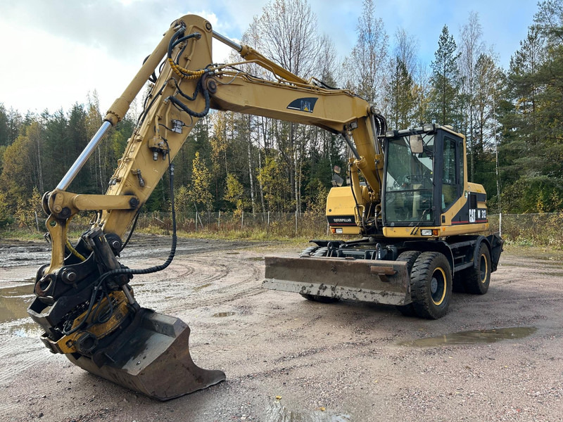 Caterpillar M312 Engcon EC20 tiltrotator - حفارة على عجلات: صور 1 Caterpillar M312 Engcon EC20 tiltrotator - حفارة على عجلات: صور 1