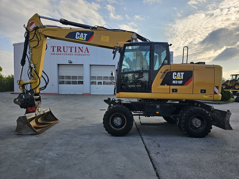 CATERPILLAR M318F - حفارة على عجلات: صور 1 CATERPILLAR M318F - حفارة على عجلات: صور 1