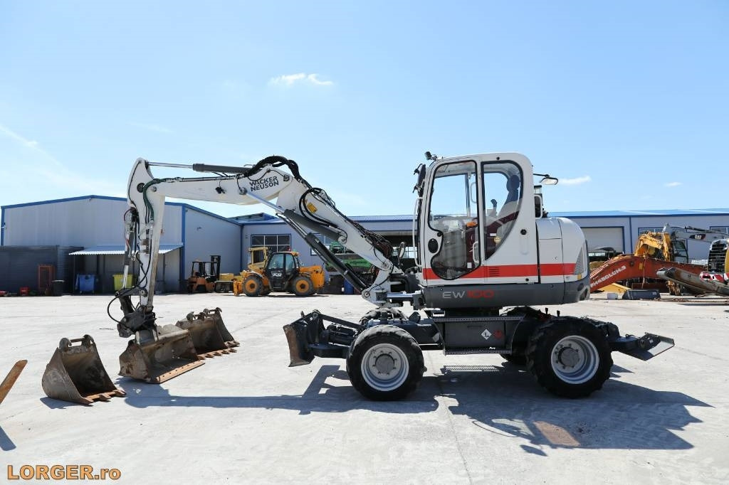 Wacker Neuson EW 100 - حفارة على عجلات: صور 1 Wacker Neuson EW 100 - حفارة على عجلات: صور 1