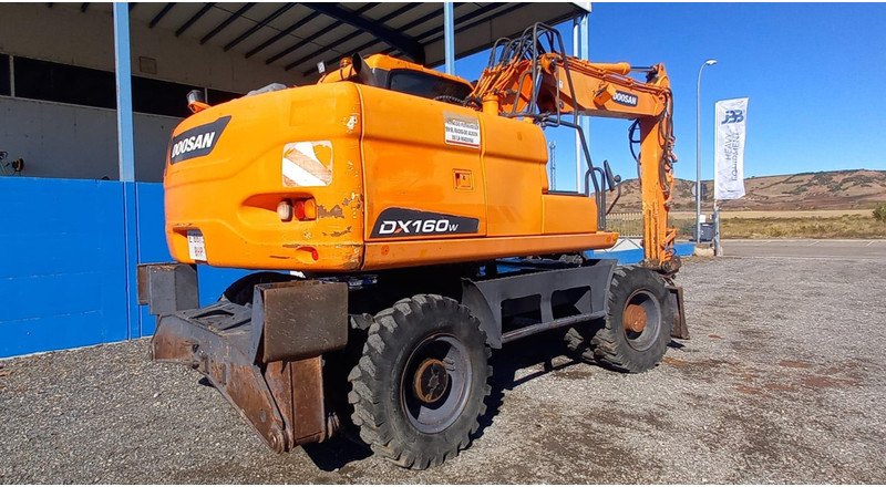 Doosan DX140W-3 - حفارة على عجلات: صور 4 Doosan DX140W-3 - حفارة على عجلات: صور 4