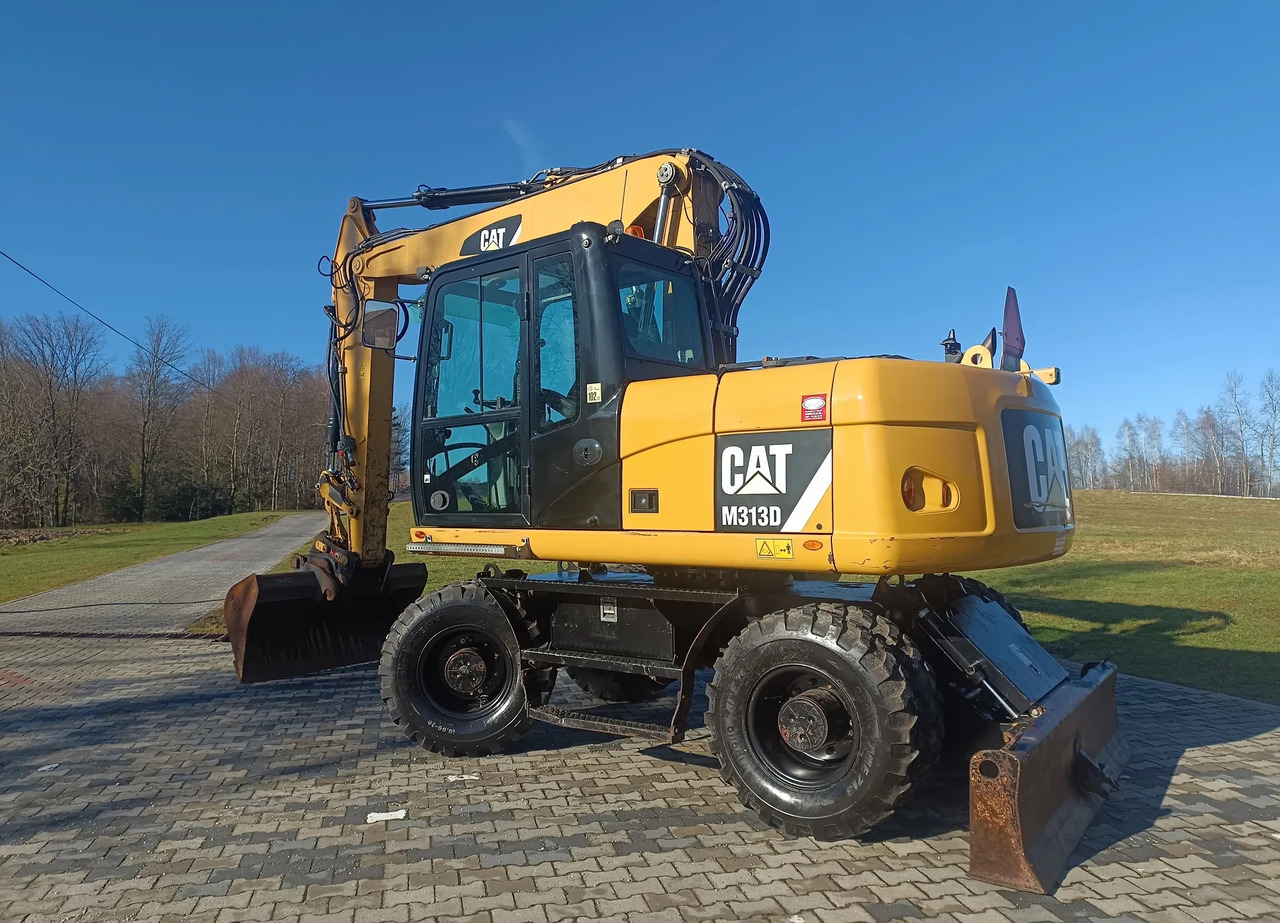 CATERPILLAR M313D - حفارة على عجلات: صور 1 CATERPILLAR M313D - حفارة على عجلات: صور 1