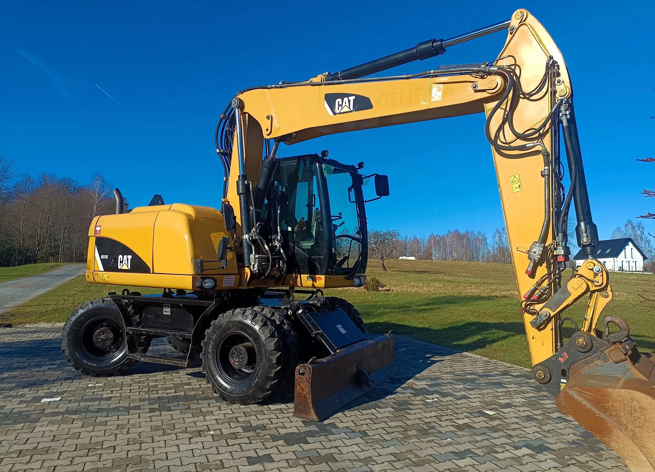 CATERPILLAR M313D - حفارة على عجلات: صور 2 CATERPILLAR M313D - حفارة على عجلات: صور 2