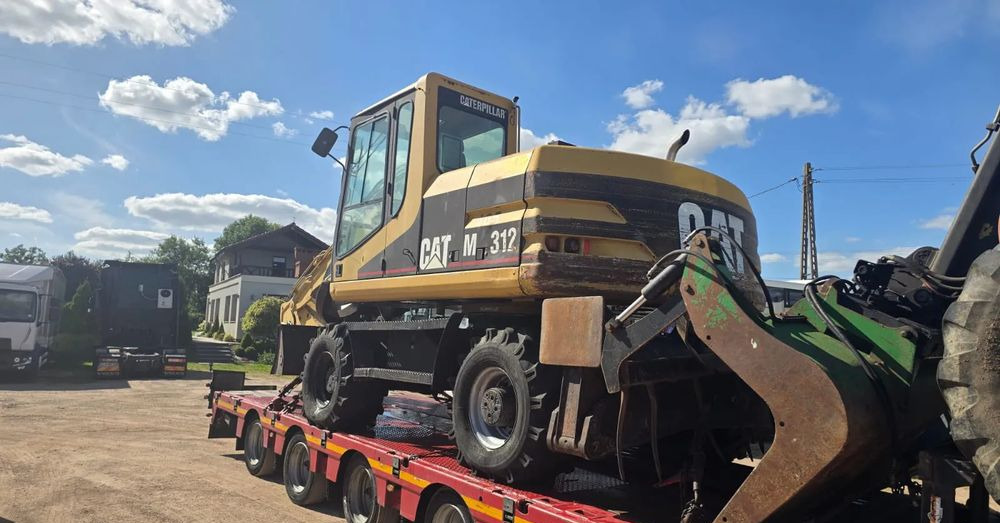 Caterpillar M312 - حفارة على عجلات: صور 4 Caterpillar M312 - حفارة على عجلات: صور 4