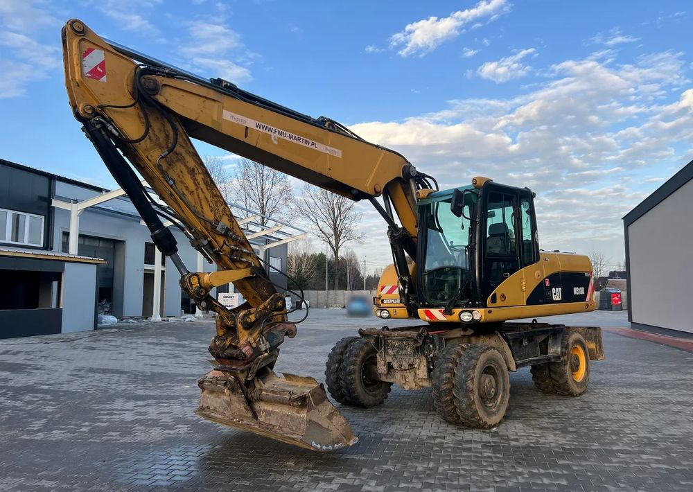 CAT Caterpillar M318D - حفارة على عجلات: صور 2 CAT Caterpillar M318D - حفارة على عجلات: صور 2