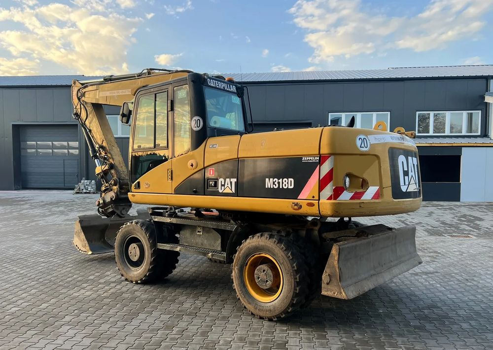 CAT Caterpillar M318D - حفارة على عجلات: صور 4 CAT Caterpillar M318D - حفارة على عجلات: صور 4