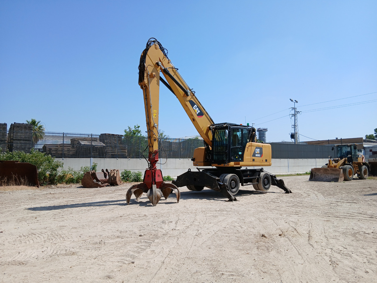 Caterpillar MH3022 - آلات البناء: صور 1 Caterpillar MH3022 - آلات البناء: صور 1