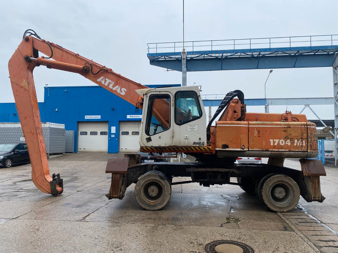 Atlas 1704 MI mit Greifer Umschlagbagger Lang - حفارة على عجلات: صور 1 Atlas 1704 MI mit Greifer Umschlagbagger Lang - حفارة على عجلات: صور 1