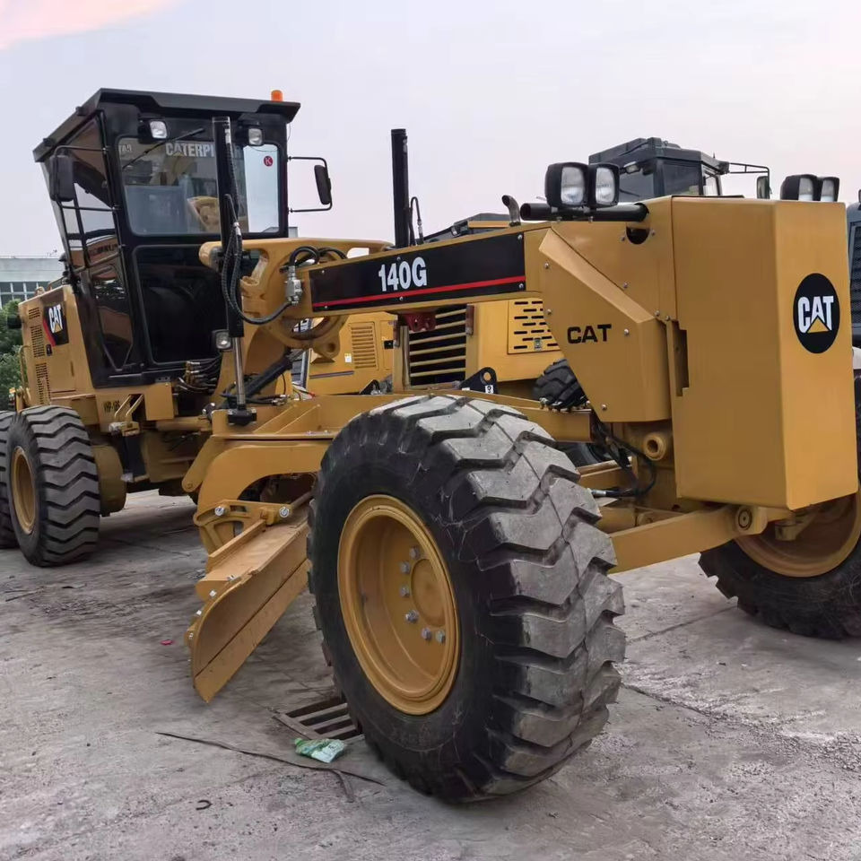 Second Hand Used Construction Machinery Japanese CAT 140G Grader Caterpillar Brand for Sale With Good Condition and Price - آلة تسوية الأرض: صور 1 Second Hand Used Construction Machinery Japanese CAT 140G Grader Caterpillar Brand for Sale With Good Condition and Price - آلة تسوية الأرض: صور 1