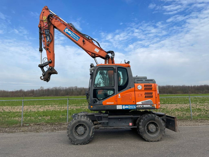 Doosan DX165W-5 - حفارة على عجلات: صور 1 Doosan DX165W-5 - حفارة على عجلات: صور 1