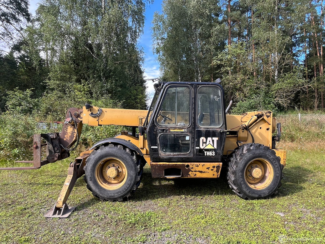 Caterpillar TH63, kurottaja piikeillä ja kauhalla, 2002, Loppi - الآلات والماكينات الزراعية: صور 3 Caterpillar TH63, kurottaja piikeillä ja kauhalla, 2002, Loppi - الآلات والماكينات الزراعية: صور 3